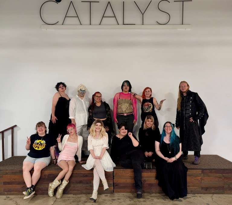 A group photo of performers on a stage